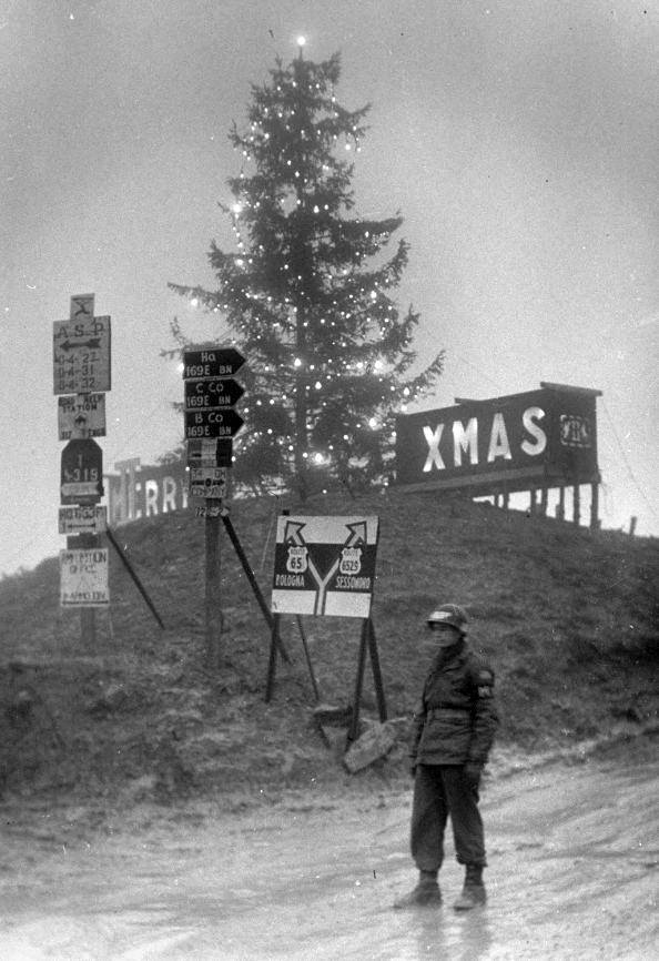 The 169th ECB road signs and Merry Christmas on Highway 65  - Winter 1944